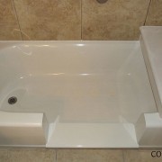 Notch cut tub to shower conversion in cast iron bathtub