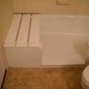 Notch cut tub to shower conversion in cast iron bathtub