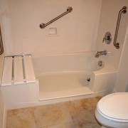 Notch cut tub to shower conversion in cultured marble bathtub
