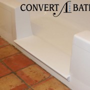 Notch cut tub to shower conversion in steel tub