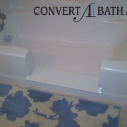 Notch cut tub to shower conversion in existing bathtub